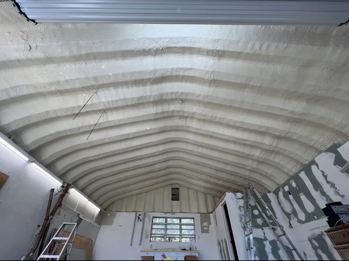 Spray polyurethane foam applied to the underside of a metal roof deck in Pittstown